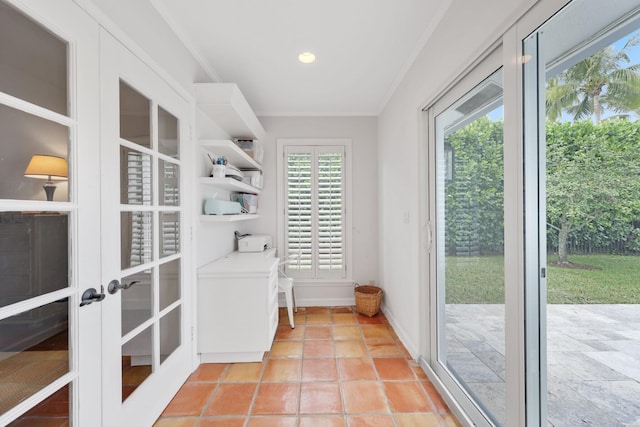 doorway featuring ornamental molding, french doors, and light tile patterned flooring