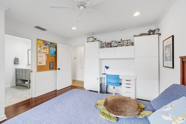 bedroom with visible vents, built in study area, ornamental molding, wood finished floors, and recessed lighting