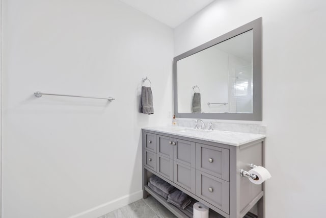 bathroom featuring vanity and baseboards