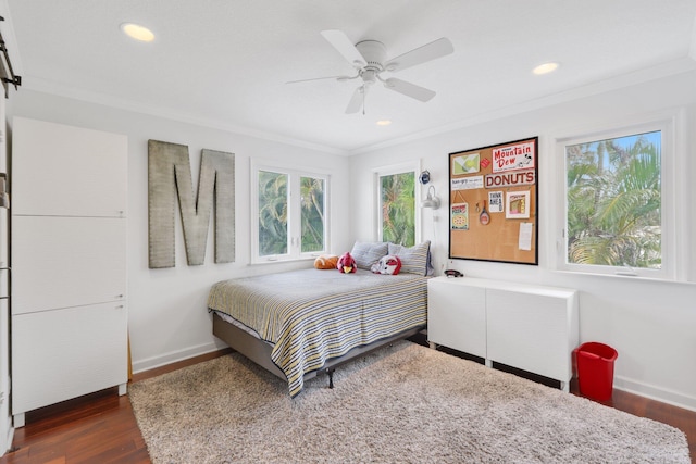 bedroom featuring crown molding, recessed lighting, dark wood-type flooring, ceiling fan, and baseboards