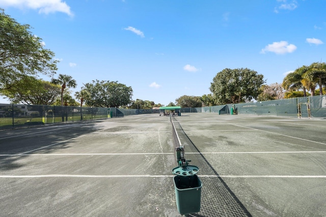 view of sport court with fence