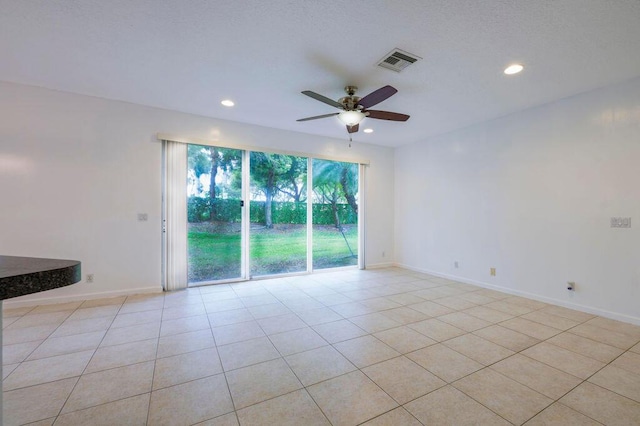 spare room with light tile patterned floors, ceiling fan, recessed lighting, visible vents, and baseboards