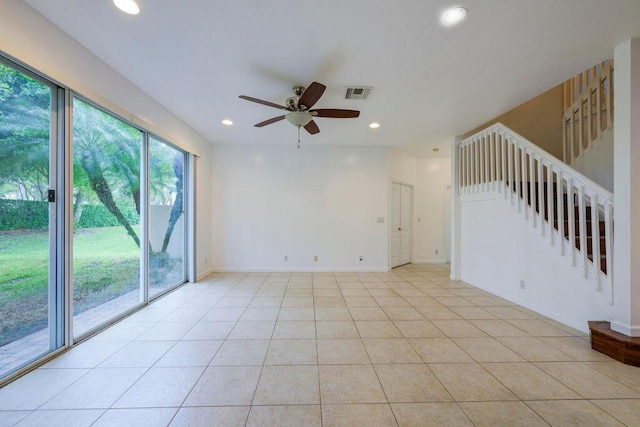 unfurnished room featuring light tile patterned floors, recessed lighting, a ceiling fan, visible vents, and stairway