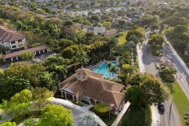 birds eye view of property featuring a water view and a residential view