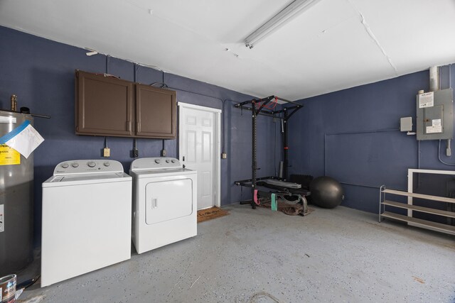 laundry area with washing machine and dryer, cabinet space, and water heater