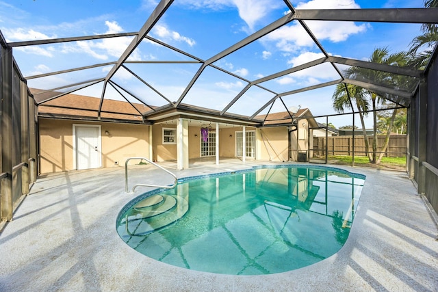 view of pool featuring a fenced in pool, glass enclosure, a patio, and fence