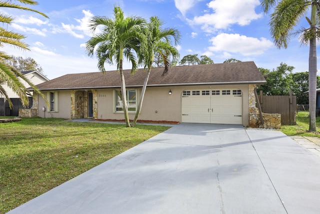 ranch-style home with a garage, concrete driveway, stucco siding, fence, and a front yard