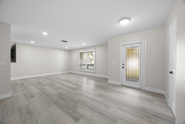 empty room featuring baseboards, recessed lighting, visible vents, and light wood-style floors