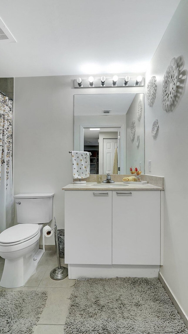 full bathroom featuring visible vents, toilet, tile patterned flooring, baseboards, and vanity