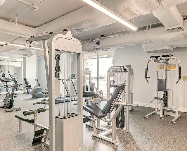 workout area featuring visible vents and baseboards