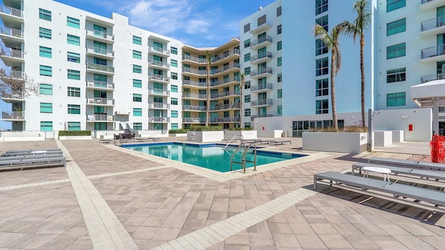 community pool featuring a patio area