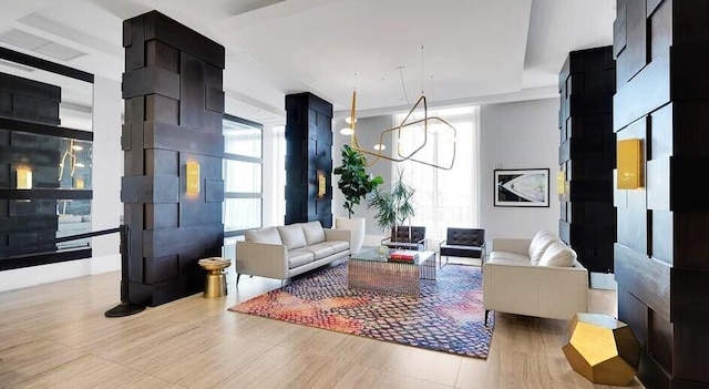 living room with an inviting chandelier