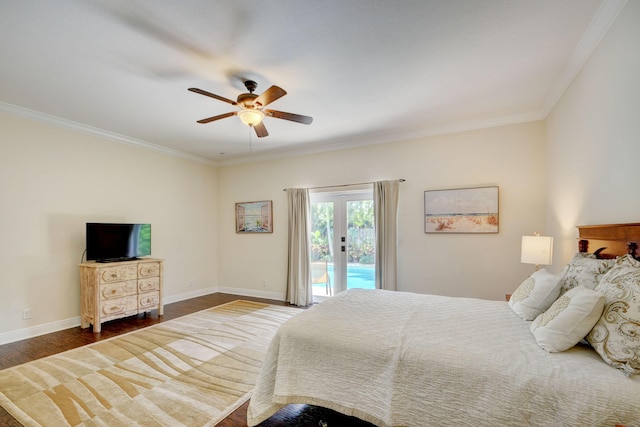 bedroom featuring wood finished floors, baseboards, access to outside, french doors, and crown molding