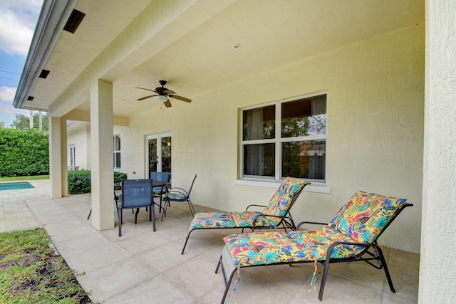 view of patio / terrace with ceiling fan and outdoor dining area