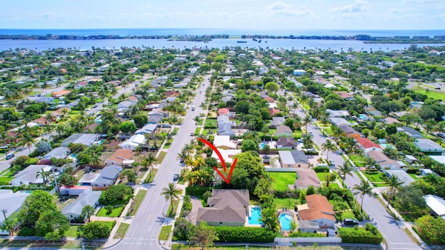 aerial view featuring a residential view and a water view