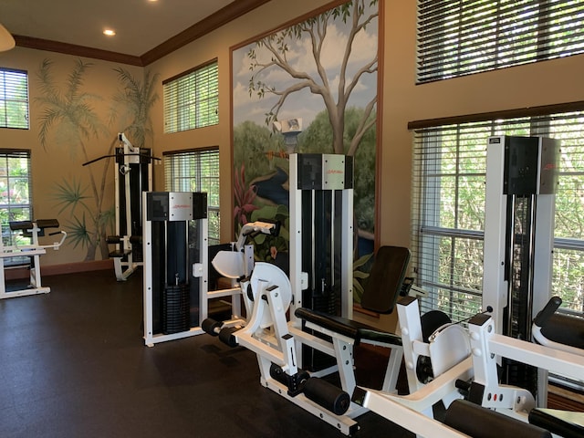700 Scotia Dr Unit 103, Hypoluxo, FL 33462 - gym featuring baseboards, ornamental molding, a towering ceiling, and wallpapered walls