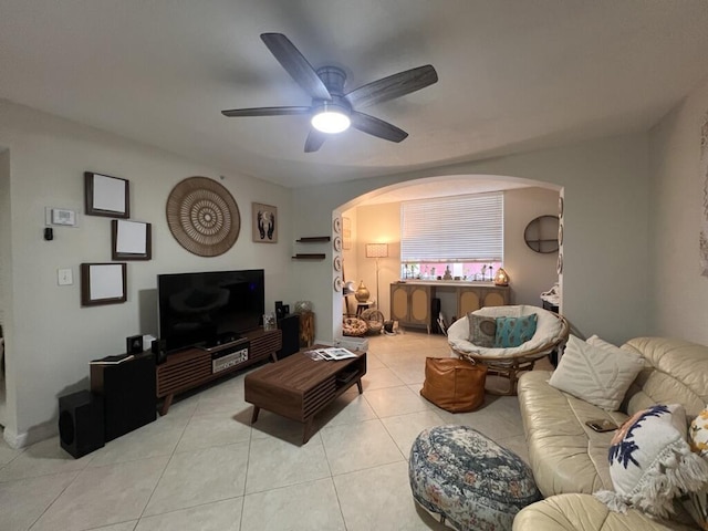 700 Scotia Dr Unit 103, Hypoluxo, FL 33462 - living area featuring arched walkways, ceiling fan, and light tile patterned floors