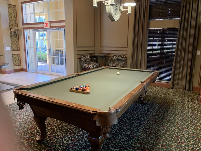 700 Scotia Dr Unit 103, Hypoluxo, FL 33462 - game room with light tile patterned floors and baseboards