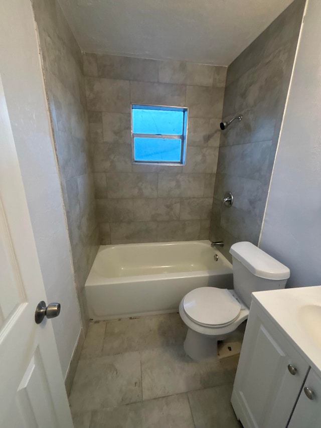 full bath featuring tile patterned flooring, shower / bath combination, vanity, and toilet