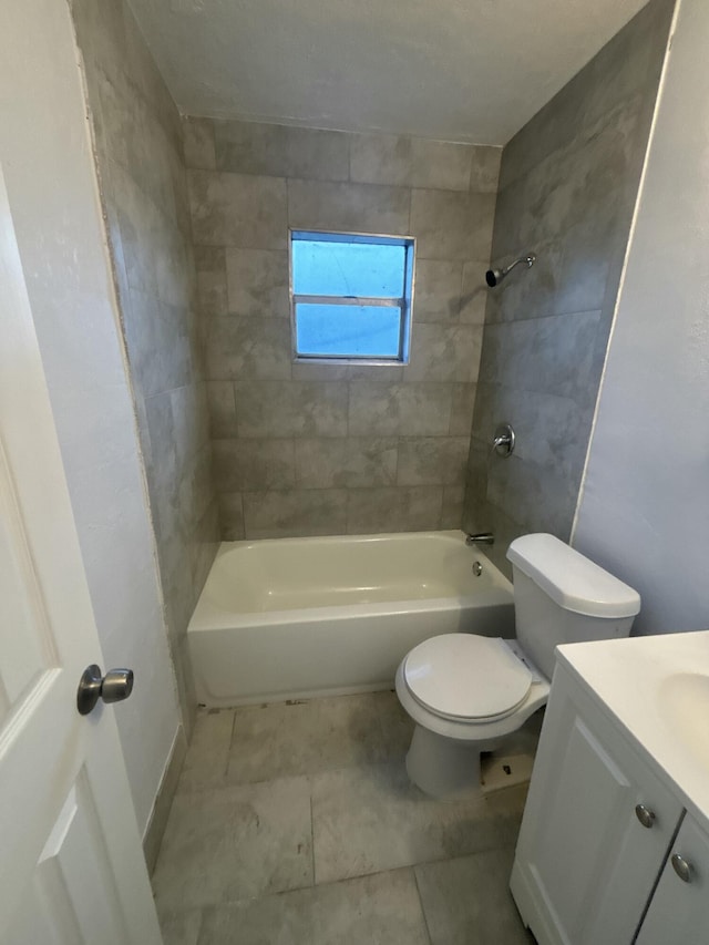 bathroom with toilet, tile patterned floors,  shower combination, and vanity