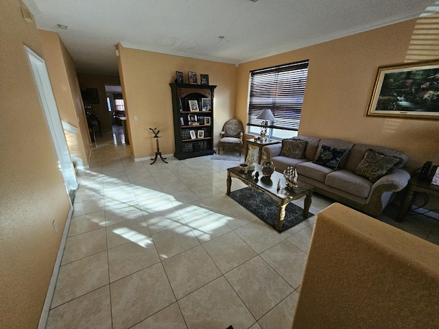 living area featuring a wealth of natural light, light tile patterned flooring, and crown molding