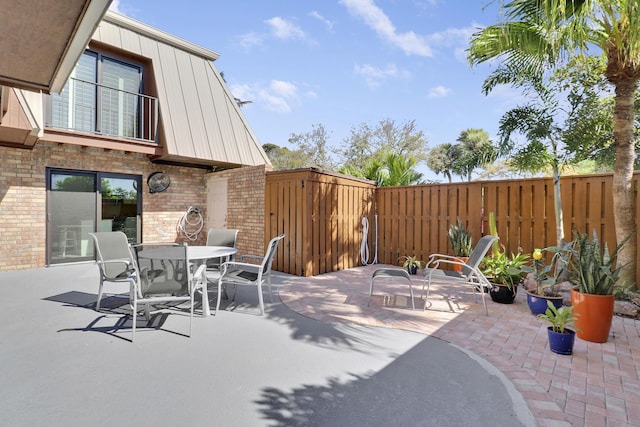 view of patio featuring fence