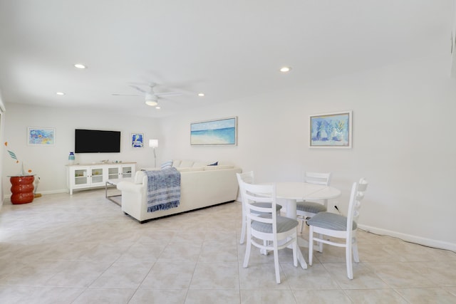 living area with light tile patterned floors, recessed lighting, baseboards, and ceiling fan