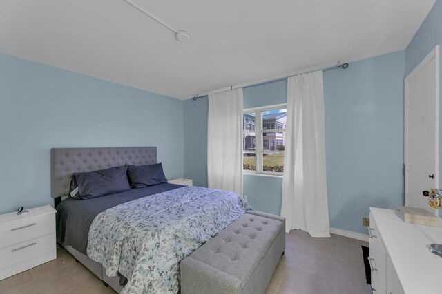 bedroom featuring baseboards