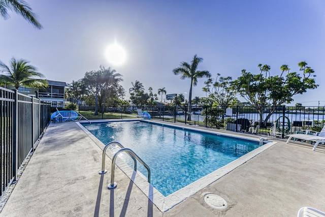 pool featuring a patio area and fence