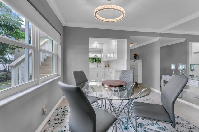 dining space featuring baseboards, tile patterned flooring, and crown molding