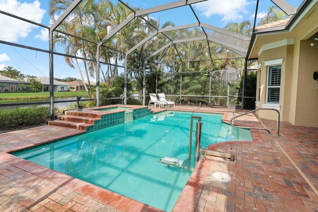 view of pool with a water view, a patio area, and a lanai