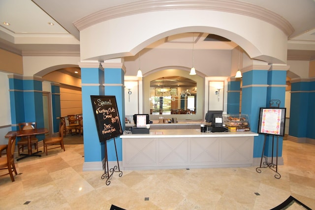 reception featuring ornate columns, arched walkways, ornamental molding, and recessed lighting