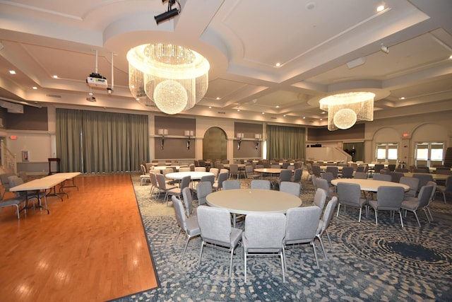 dining room with a chandelier, recessed lighting, wood finished floors, and coffered ceiling