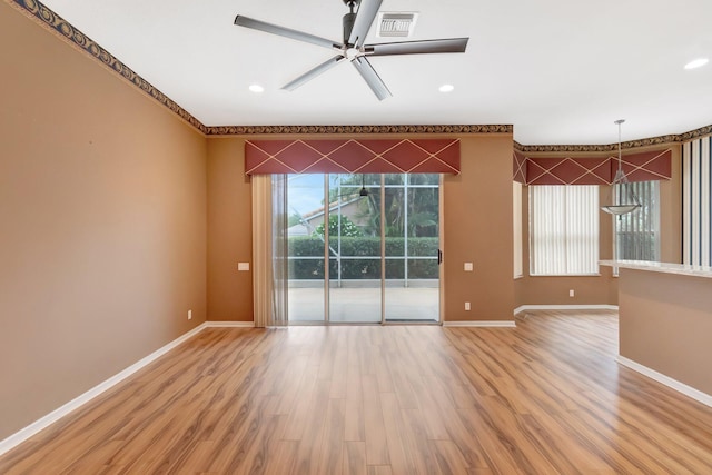 spare room featuring light wood-style flooring, baseboards, ceiling fan, and recessed lighting
