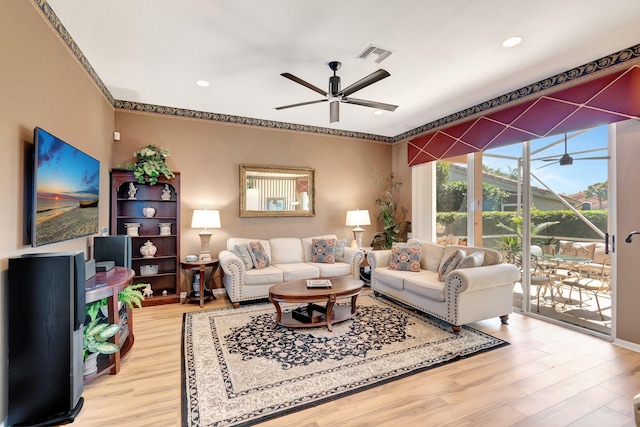 living room with light wood-style floors, visible vents, a ceiling fan, and recessed lighting