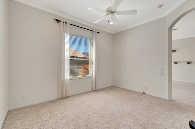 7314 Toscane Ct, Boynton Beach, FL 33437 - spare room featuring arched walkways, light colored carpet, crown molding, a ceiling fan, and baseboards