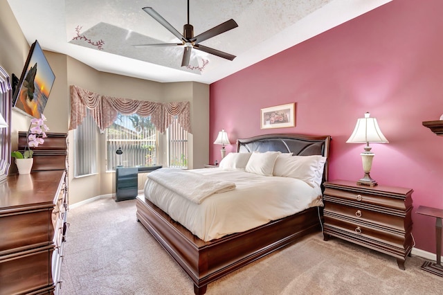 carpeted bedroom with access to exterior, a textured ceiling, baseboards, and a ceiling fan