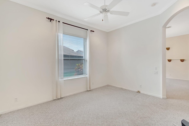 7314 Toscane Ct, Boynton Beach, FL 33437 - spare room with arched walkways, carpet flooring, ceiling fan, crown molding, and baseboards