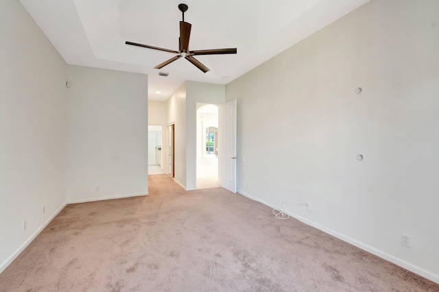 7314 Toscane Ct, Boynton Beach, FL 33437 - spare room with a ceiling fan, light colored carpet, baseboards, and arched walkways