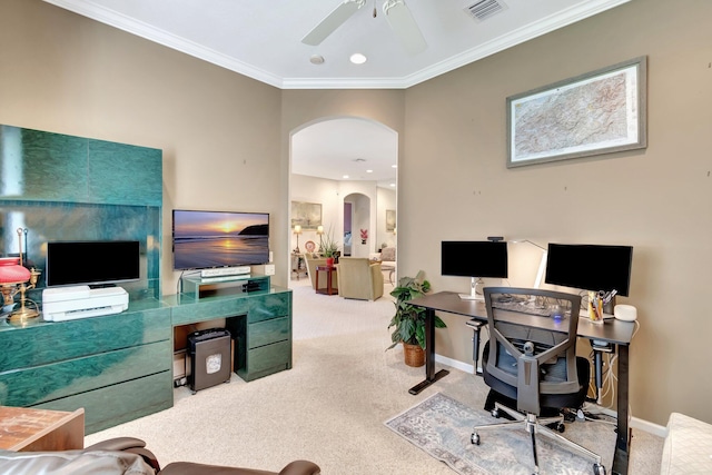 office space with arched walkways, carpet, crown molding, visible vents, and baseboards