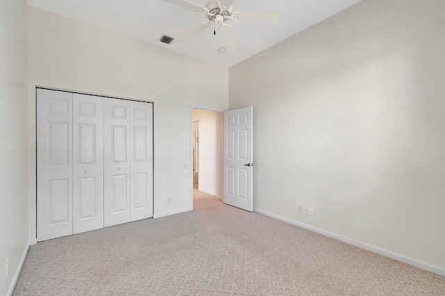 7314 Toscane Ct, Boynton Beach, FL 33437 - unfurnished bedroom featuring carpet floors, baseboards, a towering ceiling, a closet, and ceiling fan