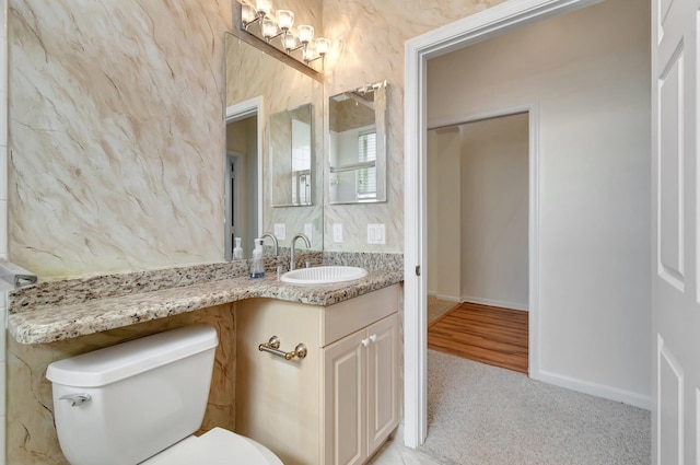 7314 Toscane Ct, Boynton Beach, FL 33437 - bathroom featuring toilet, vanity, and baseboards