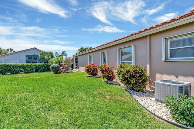 view of yard featuring central AC