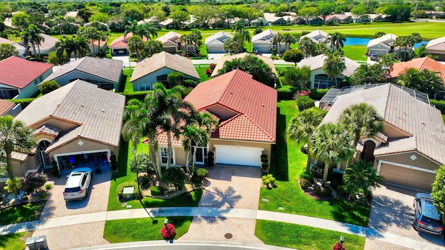 aerial view featuring a residential view and a water view