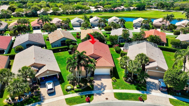 drone / aerial view with a water view and a residential view