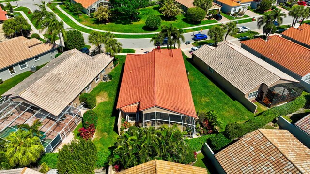 drone / aerial view featuring a water view and a residential view