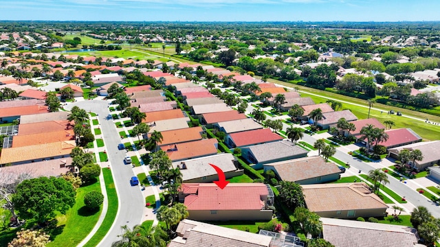aerial view of residential area featuring a large body of water