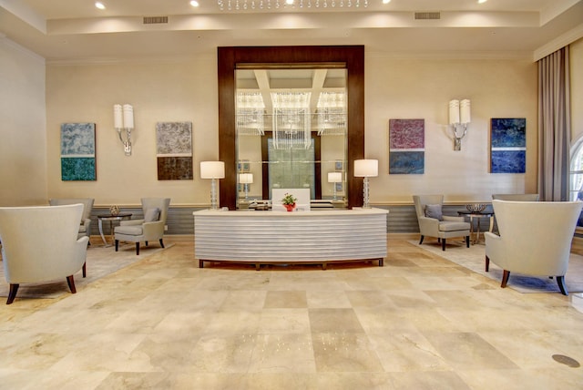 welcome area with a chandelier, recessed lighting, and ornamental molding