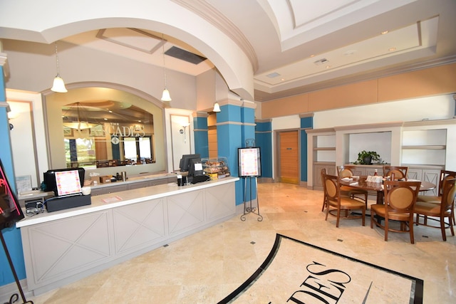 welcome area featuring arched walkways and ornamental molding