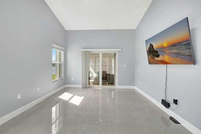 empty room with french doors and baseboards